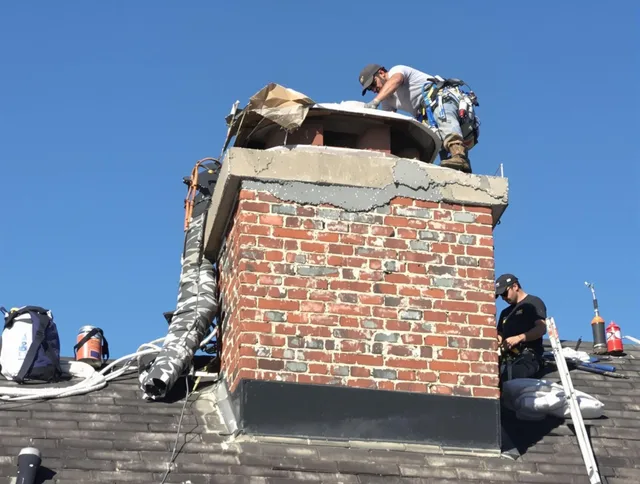 Whitehall Chimney Sweep installing a custom chimney crown in Whitehall, OH